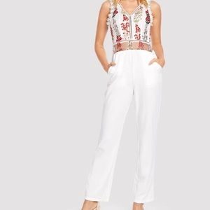white jumpsuit with mesh embroidered floral
